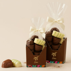 Boîte et sachet cacao désir garni de 33 bonbons de chocolat assortis